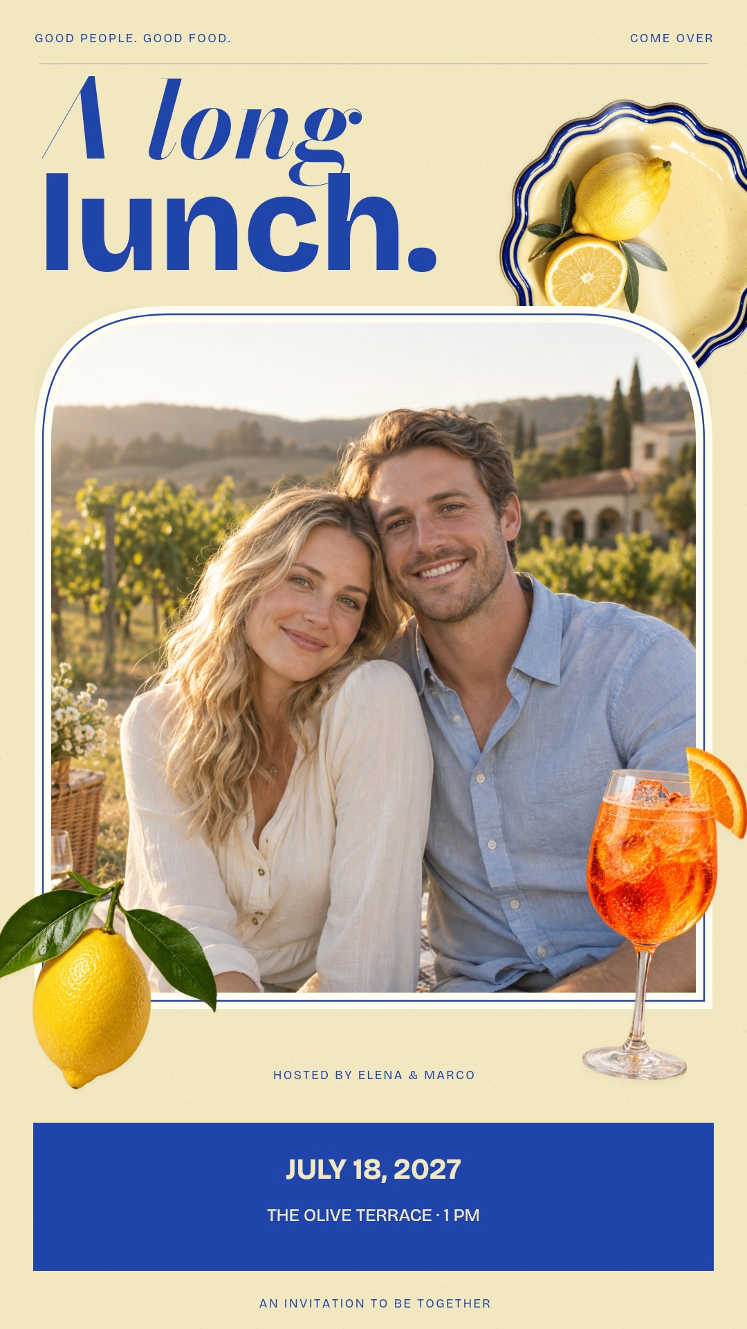 Cream and cobalt dinner invitation with a fictional couple portrait in an arched frame, ceramic plate, lemon and orange spritz.